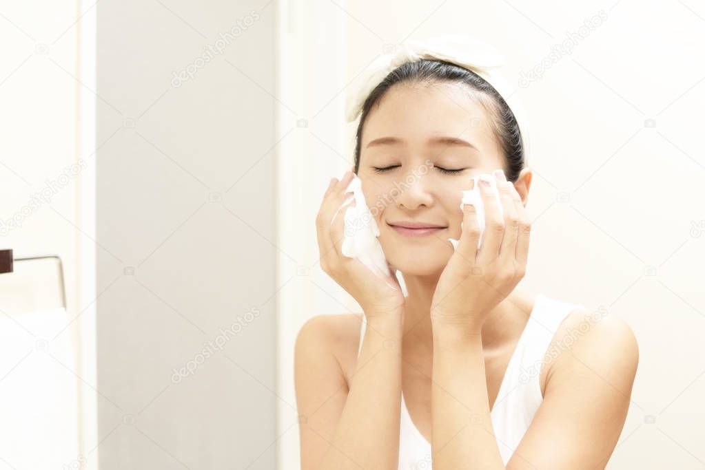 Woman washing her face