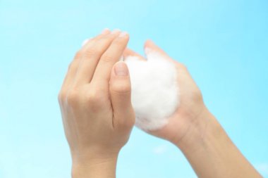 Foam of soap and female hands