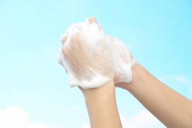 Foam of soap and female hands