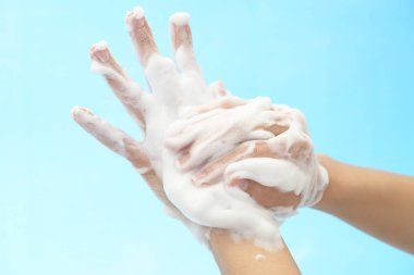 Foam of soap and female hands