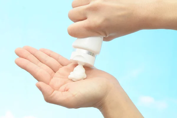 Closeup of woman\'s hands with cleansing foam