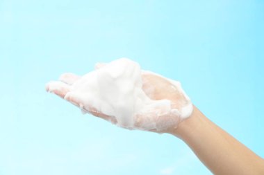 Foam of soap and female hands