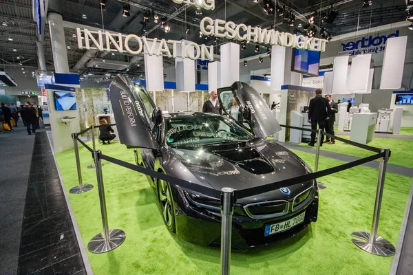 HANNOVER, JERMANY - MARCH 14, 2016: BMW car in booth of Brother company at CeBIT information technology trade show in Hannover, Germany on March 14, 2016 — Stok Foto
