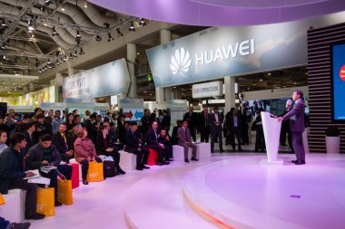 HANNOVER, GERMANY - MARCH 14, 2016: Presentation of Huawei product line president Jeff Wang in booth of Huawei company at CeBIT information technology trade show in Hannover, Germany on March 14, 2016 clipart