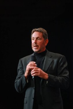 SAN FRANCISCO, CA - SEPt 19, 2010: CEO of Oracle Larry Ellison makes his speech at Oracle OpenWorld conference in Moscone center on Sep 19, 2010. He is the third in the Forbes list of richest US persons clipart