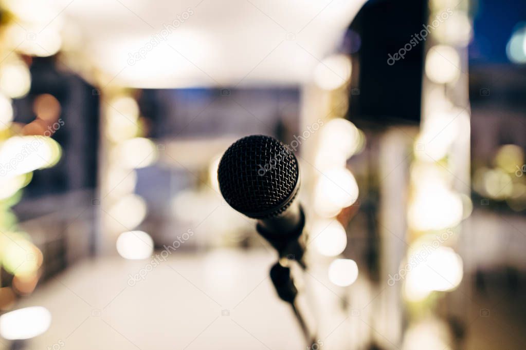 MIC ON A STAGE READY FOR THE SINGER OR SPEAKER 