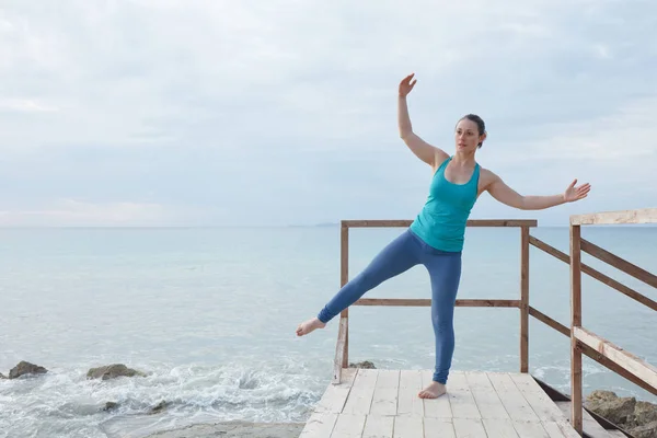 Young yoga woman in yoga pattern exercise for healthy life. Woma