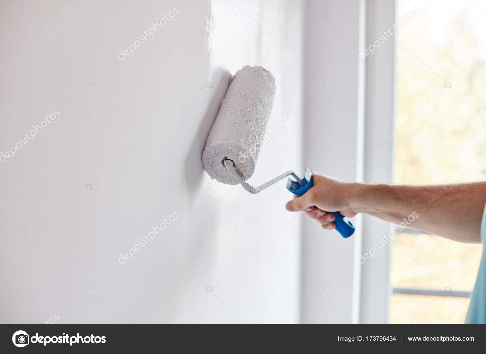 Male Hand Painting Wall With Paint Roller Painting Apartment R