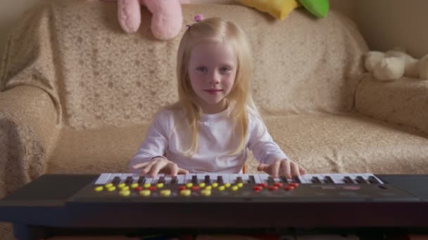 Child Girl Blonde Plays Piano — Stock Video