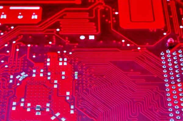 Fondo tecnológico con placa madre de computadora roja —  Fotos de Stock