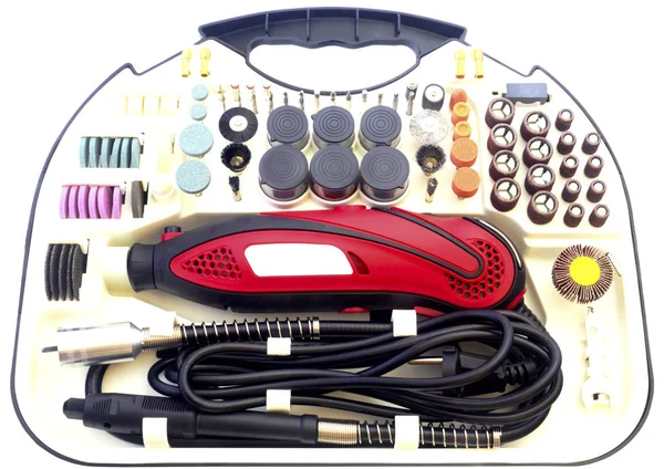 Mini taladradora con juego de diferentes accesorios de rectificado y corte aislados en blanco —  Fotos de Stock