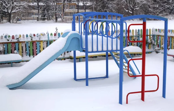 Children's playground covered with snow Royalty Free Stock Photos