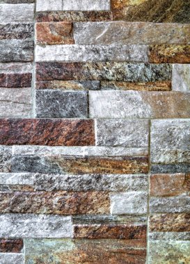 Renkli taş duvarın arkaplanı yakın görünüm