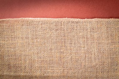 Çarşaf arka planı. Doğal organik bej tuval. Kahverengi örülmüş arka plan. Keten dokuma Malzeme pamuk arka planı