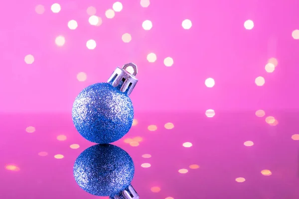 Xmas decoration on twinkle bokeh light background. New year blue ball decoration. Merry Christmas card