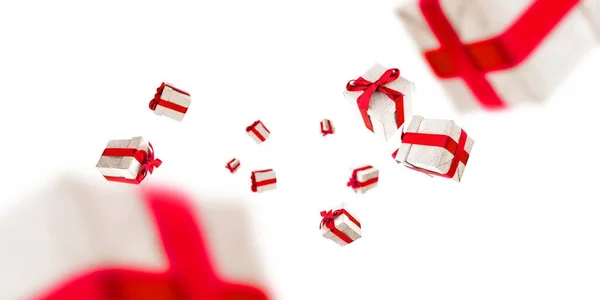 Coffrets cadeaux arc rouge sur blanc. Fond de Noël avec des boîtes Surprise. Utilisé pour anniversaire, cadeaux d'anniversaire, cartes cadeaux, cartes postales — Photo