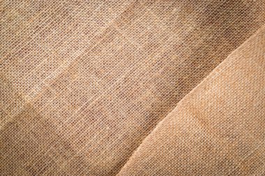 Çarşaf arka planı. Doğal organik bej tuval. Kahverengi örülmüş arka plan. Keten dokuma Malzeme pamuk arka planı