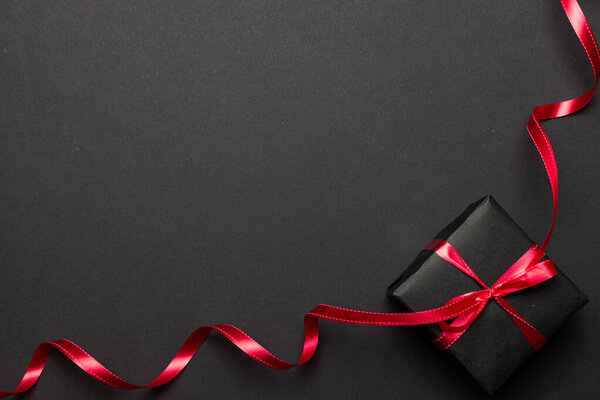 Xmas decoration. red Christmas gifts, ornaments on black background. Winter holiday xmas present concept. Merry Christmas and Happy Holidays greeting card, frame, banner