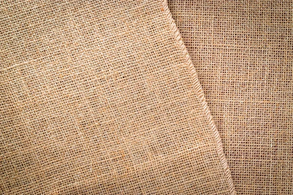 Tessitura di lino. Tela naturale marrone organico. Sfondo tessuto beige. Lino materiale sfondo — Foto Stock