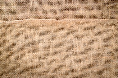 Keten desenli. Doğal organik kahverengi tuval. Bej işlemeli arka plan. Keten Malzeme Arkaplanı