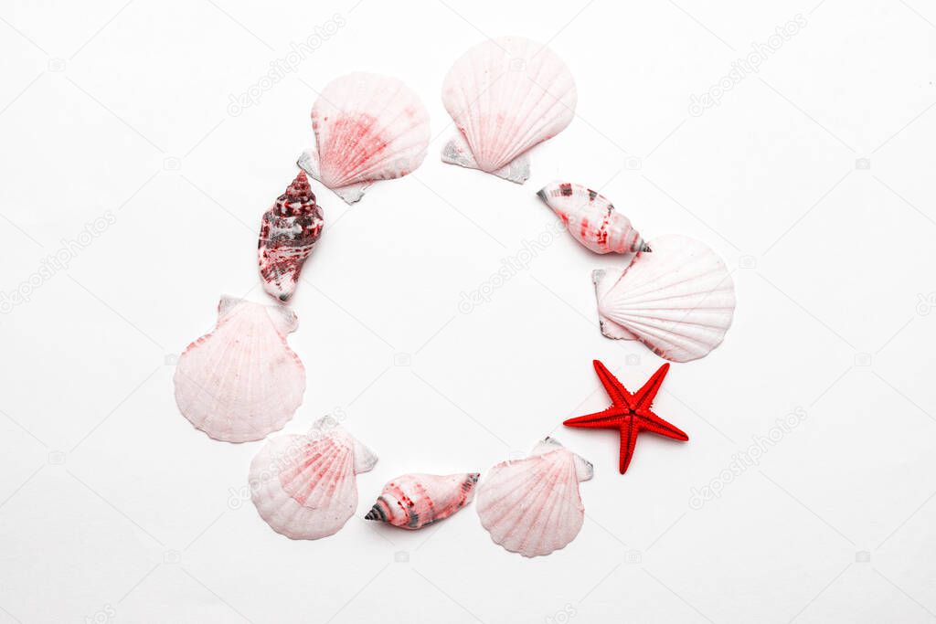 Hello Summer text on white background with Living Coral color Shells, red starfish. Hello summer travel vacation concept, flat lay poster backdrop.