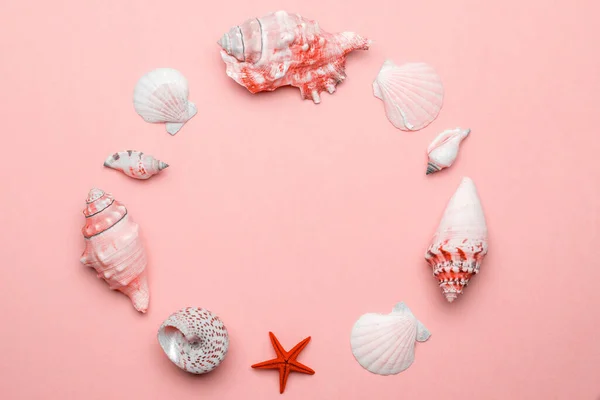Hello Summer text on trendy Living Coral pastel color background with Shells, red starfish. Hello summer travel vacation concept, flat lay poster backdrop.