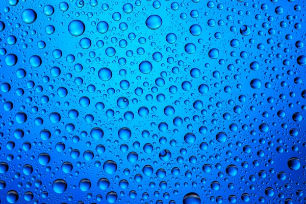 Gotas textura. Agua mojada sobre fondo de vidrio. Patrón de burbuja . — Foto de Stock