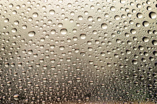 Krople wody na szybę. Tekstura deszczowa lub mokry wzór tła. — Zdjęcie stockowe