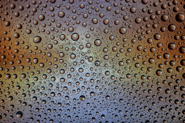 Gotas de agua en el vaso. Mojado lluvia patrón textura fondo . — Foto de Stock