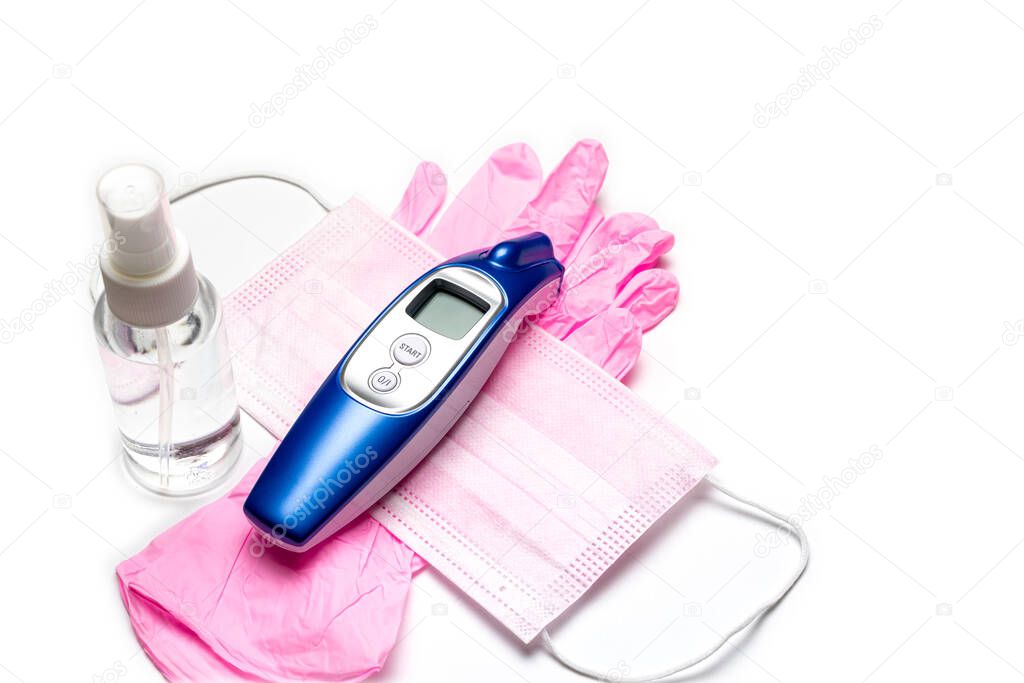 Sanitizer bottle, Medical surgical mask, modern thermometer and lab gloves - Virus protection equipment on white background. COVID middle East respiratory syndrome coronavirus. corona virus disease