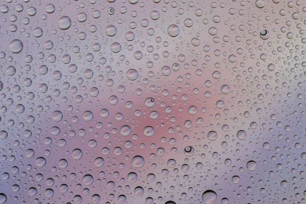 Upuszcza wodę na szkło. mokry deszcz wzór tekstury tło. — Zdjęcie stockowe