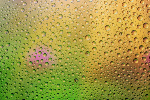 Water drops background. Rain texture on window glass. Wet pattern.