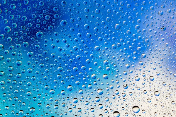Deixa cair a textura. Água molhada no fundo de vidro. Padrão bolha . — Fotografia de Stock