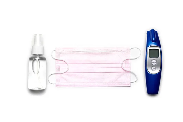 Protection covid. Medical respirator bandage face sanitizer gel, Electronic thermometer and lab gloves - Virus protection equipment on white background. Dangerous Chinese COVID-19, pandemic risk alert Stock Picture