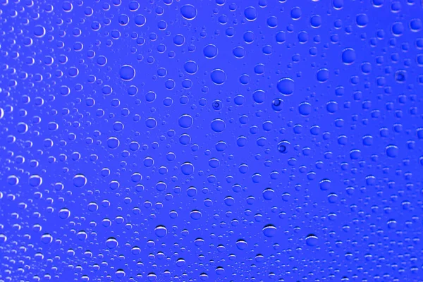 Chuva padrão de gotas. Água molhada no vidro da janela. Fundo bolha . — Fotografia de Stock