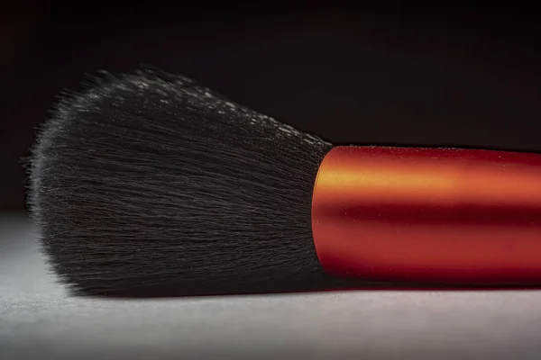 Makeup brush on a dark background — Stock Photo, Image