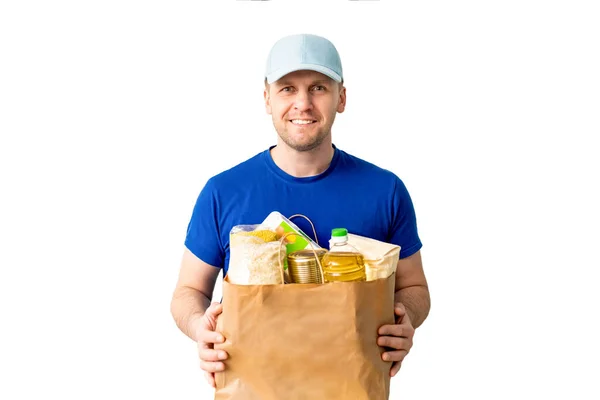 Happy Delivery man in blue cap blank tshirt uniform glove hold darowizny worek na izolowane na białym tle. Koncepcja pandemii pandemii koronawirusowej 2019-ncov Pandemia. Oddawanie żywności — Zdjęcie stockowe