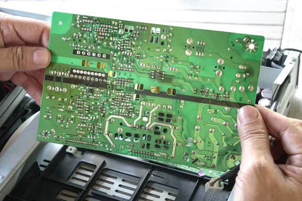 Hands holding PCB board — Stock Photo, Image