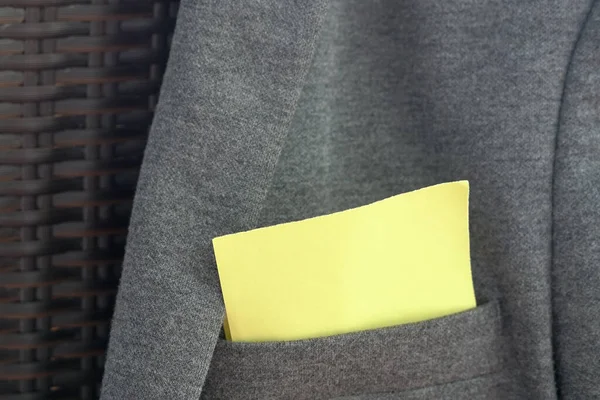 Blank Yellow Paper Stuck Out Pocket Grey Jacket Space Text — Stock Photo, Image