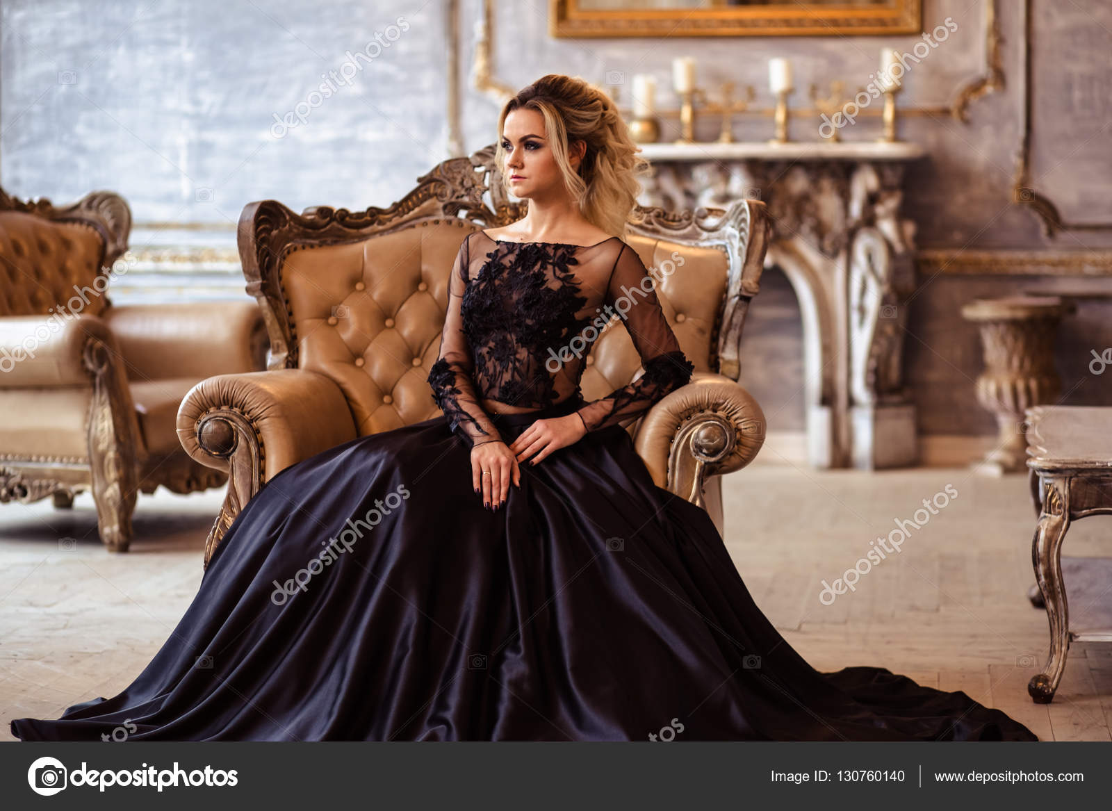 Beautiful young woman in gorgeous black evening dress with perfect makeup  and hair style Stock Photo by ©cherry_daria 130760140