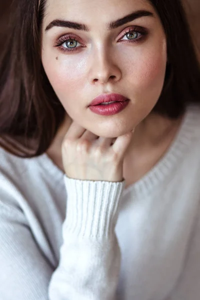 Close-up portrait of beautiful young woman in casual clothes in a loft interior — Stock Photo, Image