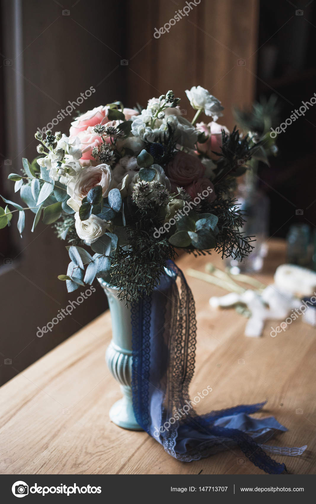 Florist workplace: flowers and accessories on a vintage wooden table. soft  focus. Modern bouquet in a vase on a table, simple composition Stock Photo  by ©cherry_daria 147713707
