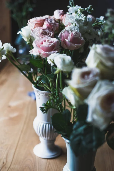 Florist workplace: flowers and accessories on a vintage wooden table. soft focus Stock Image