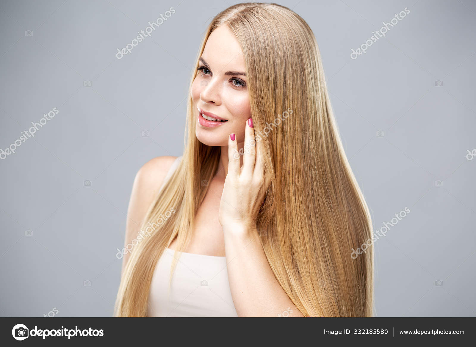 Cute girl with long straight blonde hair and healthy skin