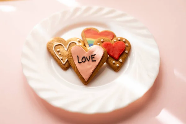 Glazed heart shaped cookies. LGBT and love text. Baking with love for Valentine's day, love and diversity concept. — Stock Photo, Image