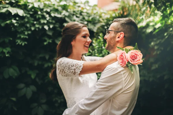 Newlywed couple looking at each other hugging dance and smiling on their wedding day. Union and love concept. Royalty Free Stock Photos