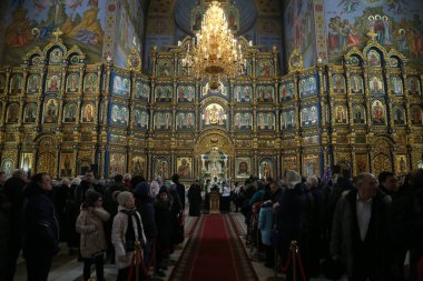 local residents coming to Holy Assumption Cathedral on 7 January 2019 in Astana, Kazakhstan clipart