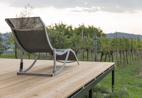 Recreational empty deck chair with mediterranean vineyards — Stock Photo, Image