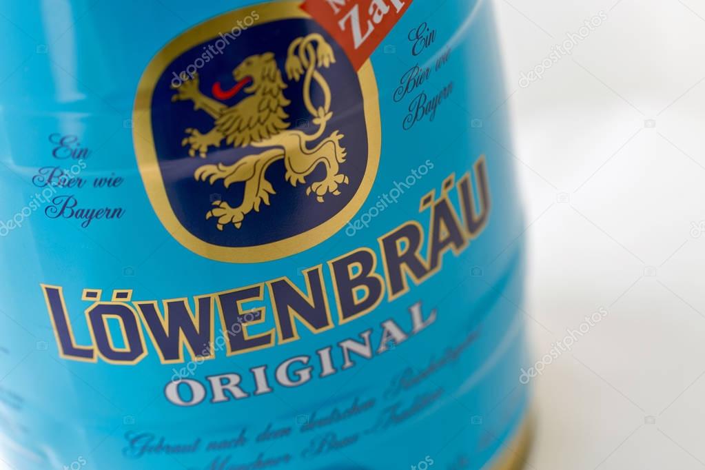 KIEV, UKRAINE - APRIL 17, 2016: Lowenbrau small barrel of beer can closeup against white with copy space. Lowenbrau is a brewery founded in Munich around 1383, its name means lion's brew in German.