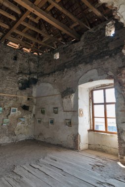 Art gallery in abandoned medieval castle Saint Miklosh, Chynadievo, Ukraine. clipart
